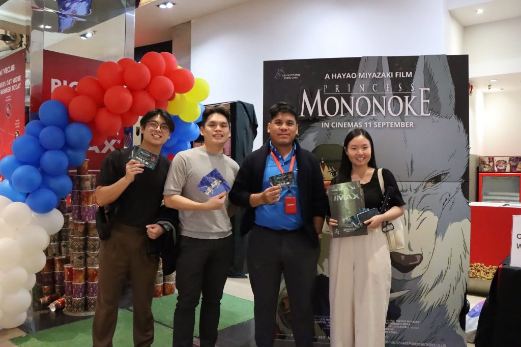 Fans posing with Princess Mononoke event posters at the TGV fan screening photo area. | TGV Blog